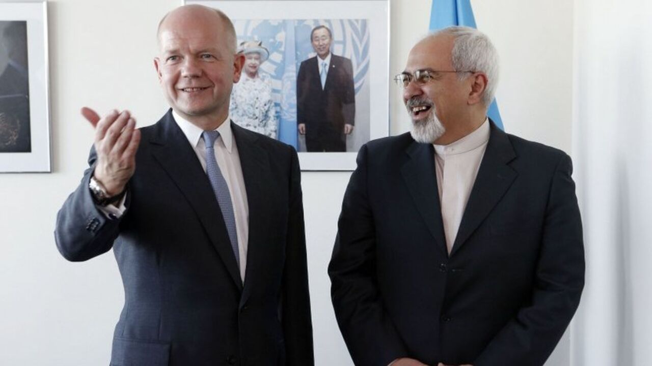 British Foreign Minister William Hague meets with Iran's Foreign Minister Mohammad Javad Zarif at the beginning of their bilateral meeting at the United Nations in New York British Foreign Minister William Hague (L). gestures as he meets with Iran's Foreign Minister Mohammad Javad Zarif at the beginning of their bilateral meeting at the United Nations in New York September 23, 2013. REUTERS/Jason DeCrow/Pool (UNITED STATES - Tags: POLITICS) - RTX13X4E