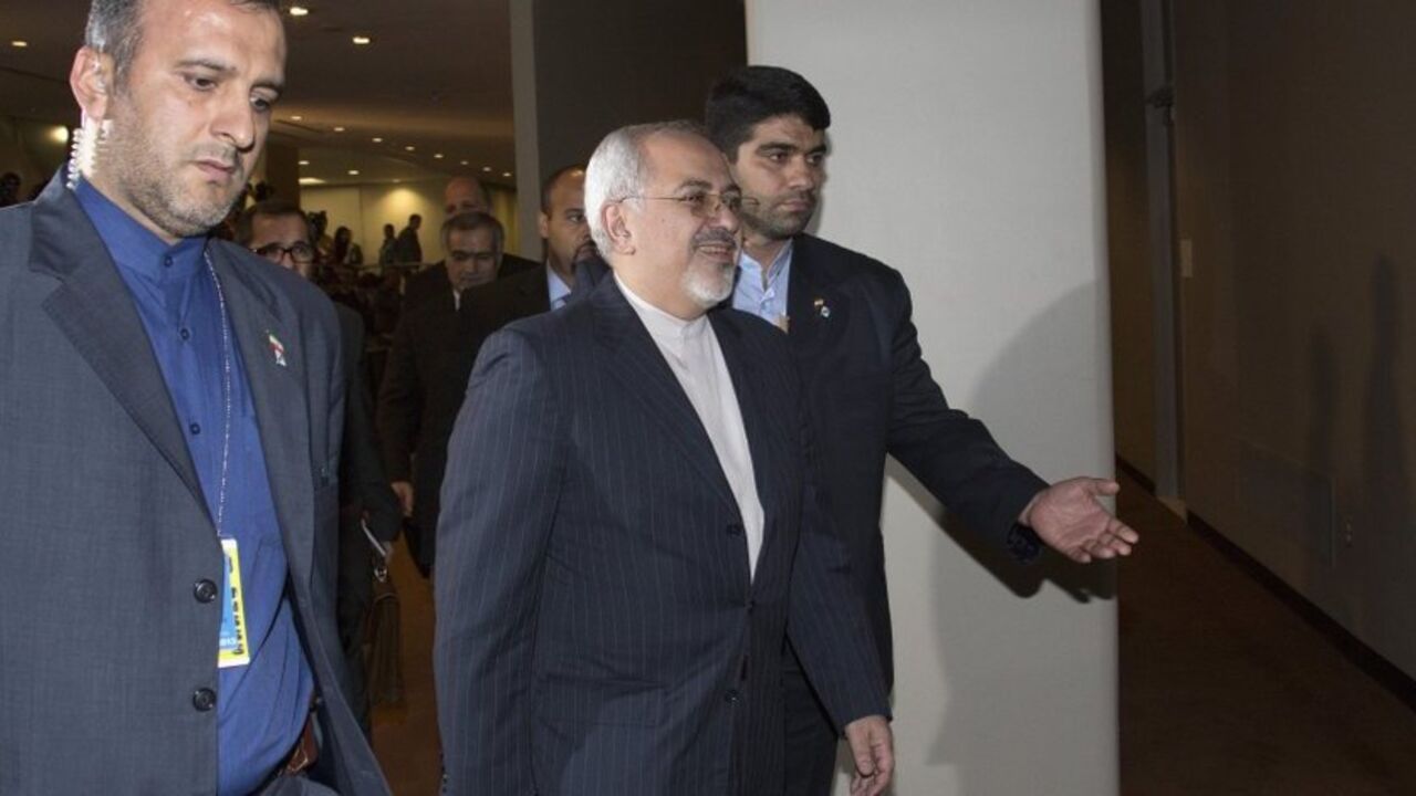 Iran's Foreign Minister Mohammad Zarif arrives to meet with the foreign ministers representing the permanent five member countries of the United Nations Security Council, including Germany, at UN Headquarters in New York Iran's Foreign Minister Mohammad Javad Zarif (C) arrives to meet with the foreign ministers representing the permanent five member countries of the United Nations Security Council, including Germany, at UN Headquarters in New York September 26, 2013. Iran's new government began its first talks on its nuclear program with the United States and five other world powers on Thursday, with the Iranian foreign minister taking a seat next to U.S. Secretary of State John Kerry in a rare high-level contact between th