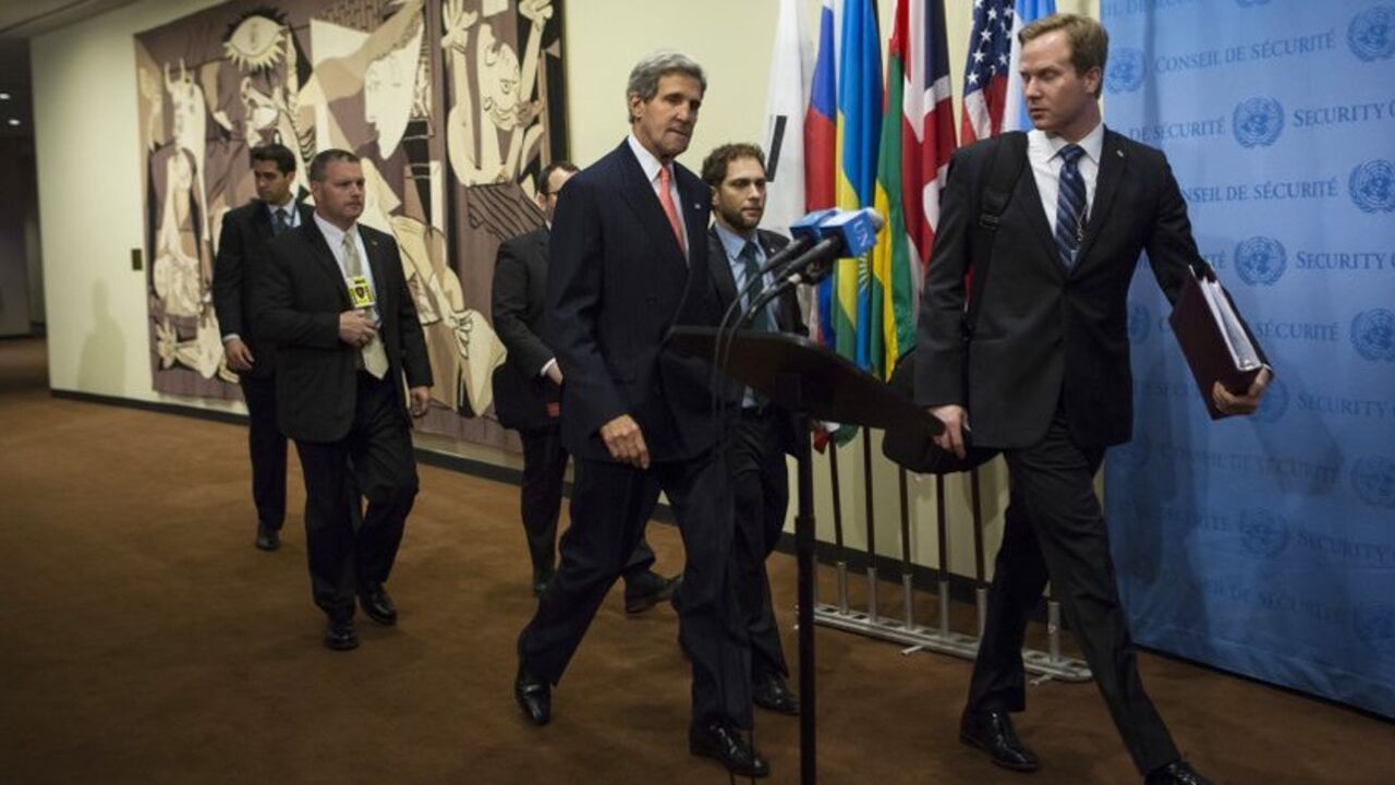 U.S. Secretary of State John Kerry arrives at a meeting at the U.N. Headquarters in New York U.S. Secretary of State John Kerry (C) arrives at a meeting of the foreign ministers representing the permanent five member countries of the United Nations Security Council, including Germany, at the U.N. Headquarters in New York September 26, 2013. U.S. and Iranian officials emerged upbeat on Thursday from a meeting on Iran's nuclear program but both sides also sounded a cautionary note, with the United States saying there was more work to do and Iran insisting on quick sanctions relief. REUTERS/Eric Thaye