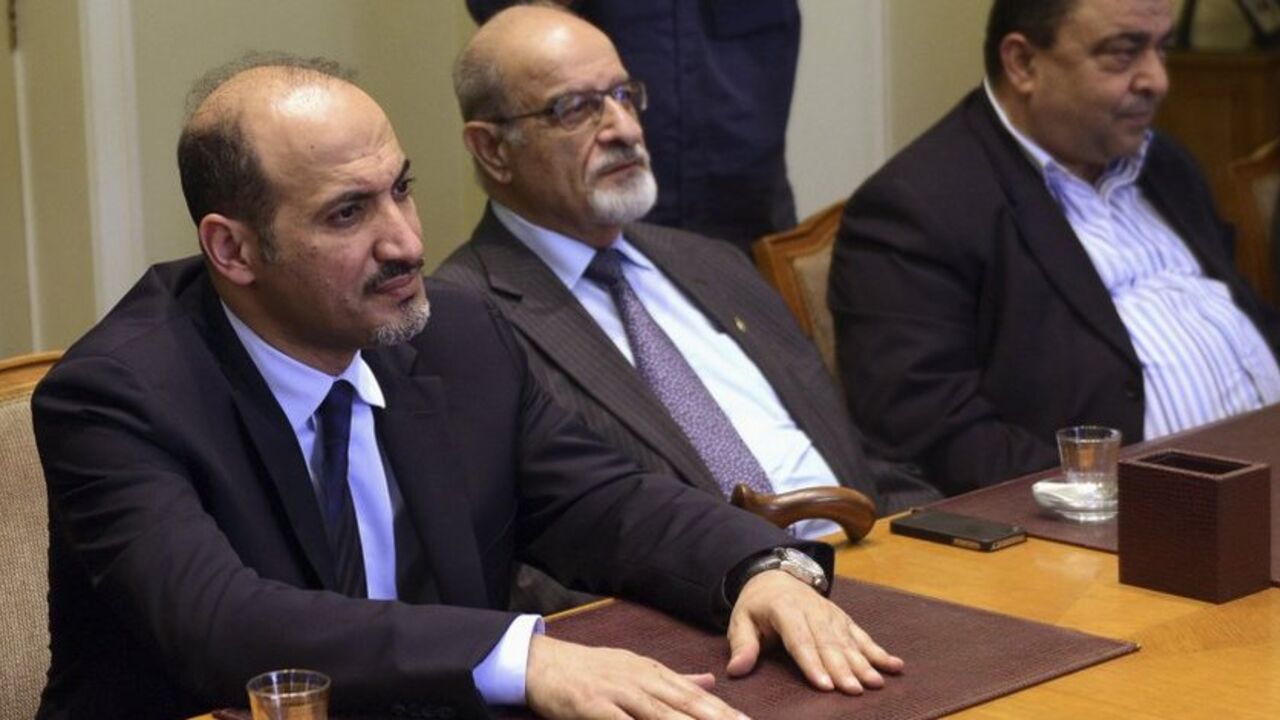 President of the Syrian National Coalition, Ahmad Al-Jarba, looks on during a meeting with Arab League Secretary General Nabil al-Arabi in Cairo President of the Syrian National Coalition, Ahmad Al-Jarba (L), looks on during a meeting with Arab League Secretary General Nabil al-Arabi (not pictured) in Cairo, November 2, 2013. Arab League Foreign Ministers will meet in Cairo in an emergency session to discuss the ongoing crisis in Syria on Sunday. REUTERS/Stringer (EGYPT - Tags: POLITICS) - RTX14XDS