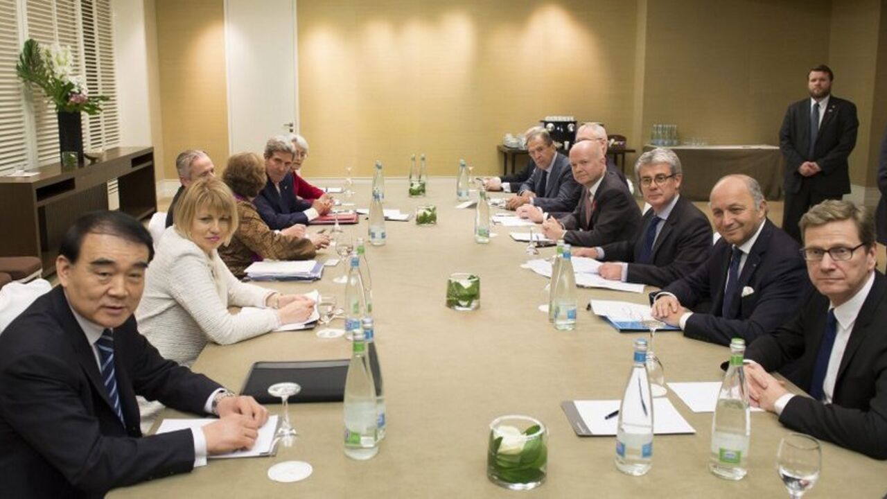 Diplomats speak together during the third day of closed-door nuclear talks at the Intercontinental Hotel in Geneva (L, front - back) Chinese Vice Foreign Minister Li Baodong, EU High Representative for Foreign Affairs Catherine Ashton, U.S. Secretary of State John Kerry, (R, front - back) Germany's Foreign Minister Guido Westerwelle, French Foreign Minister Laurent Fabius, British Foreign Secretary William Hague and Russian Foreign Minister Sergei Lavrov, speak together during the third day of closed-door nuclear talks at the Intercontinental Hotel in Geneva, November 9, 2013. Barring a last-minute breakthrough, talks b