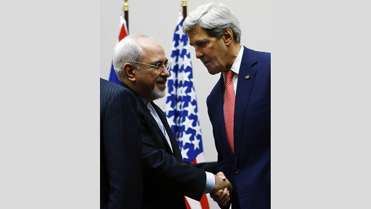 US Secretary of State Kerry shakes hands with Iranian Foreign Minister Zarif after a ceremony at the United Nations in Geneva U.S. Secretary of State John Kerry (R) shakes hands with Iranian Foreign Minister Mohammad Javad Zarif after a ceremony at the United Nations in Geneva November 24, 2013. Iran and six world powers reached a breakthrough agreement early on Sunday to curb Tehran's nuclear programme in exchange for limited sanctions relief, in a first step towards resolving a dangerous decade-old standoff. REUTERS/Denis Balibouse (SWITZERLAND - Tags: POLITICS ENERGY) - RTX15QLU