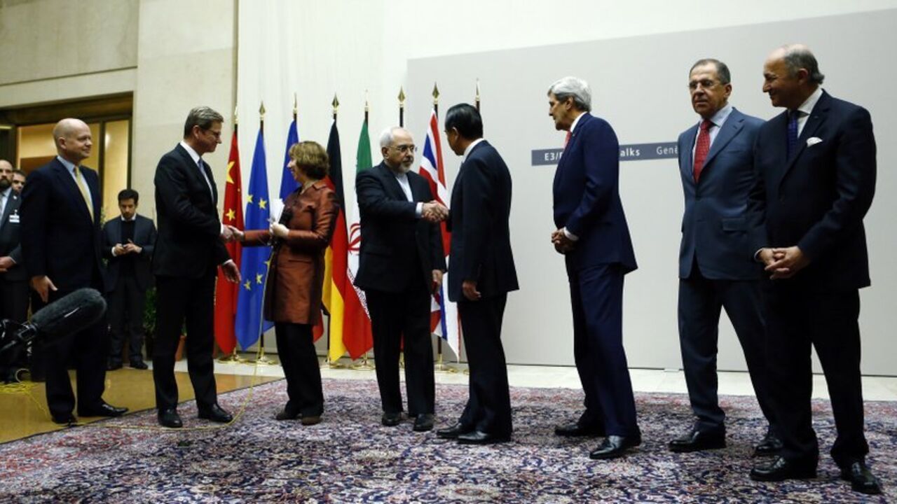 Foreign ministers shake hands after a ceremony at the United Nations in Geneva British Foreign Secretary William Hague, Germany's Foreign Minister Guido Westerwelle, European Union foreign policy chief Catherine Ashton, Iranian Foreign Minister Mohammad Javad Zarif, Chinese Foreign Minister Wang Yi, U.S. Secretary of State John Kerry, Russia's Foreign Minister Sergei Lavrov and French Foreign Minister Laurent Fabius (L-R) shake hands after a ceremony at the United Nations in Geneva November 24, 2013. Iran and six world powers reached a breakthrough agreement early on Sunday to curb Te
