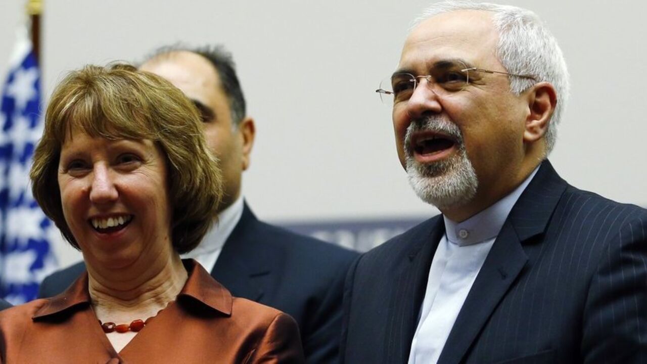 European Union foreign policy chief Ashton smiles next to Iranian Foreign Minister Zarif during a ceremony at the United Nations in Geneva European Union foreign policy chief Catherine Ashton (L) smiles next to Iranian Foreign Minister Mohammad Javad Zarif during a ceremony at the United Nations in Geneva November 24, 2013. Iran and six world powers reached a breakthrough agreement early on Sunday to curb Tehran's nuclear programme in exchange for limited sanctions relief, in a first step towards resolving a dangerous decade-old standoff. REUTERS/Denis Balibouse (SWITZERLAND - Tags: POLITICS ENERGY TPX IMAGES OF THE DAY) - RTX15QNS