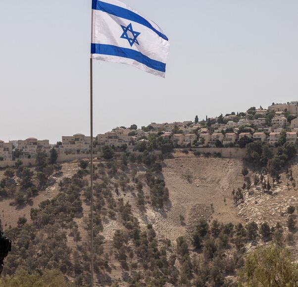 Israeli policemen stand guard near the settlement of Maale Adummim, in a land corridor known as E1, outside Jerusalem in the occupied West Bank on Aug. 14, 2025.