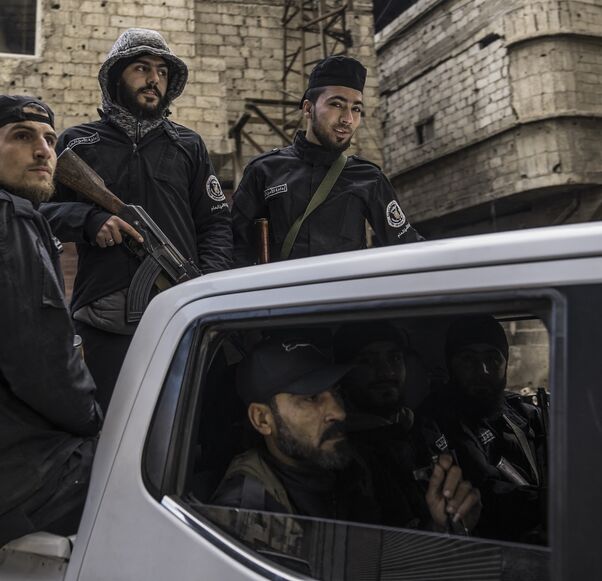 Syria's internal security forces are deployed in Tadamon to secure a protest in Tadamon, Syria, on Feb. 7, 2025. 