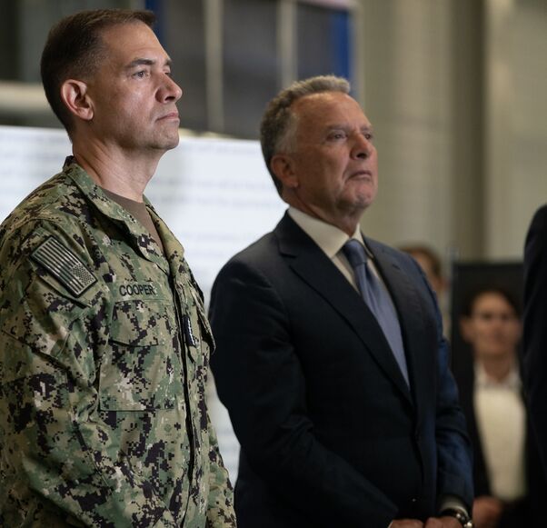 Steve Witkoff, US special envoy to the Middle East, (C) Adm. Brad Cooper, commander of the United States Central Command (CENTCOM), (L) and Jared Kushner listen as US Vice President JD Vance speaks.