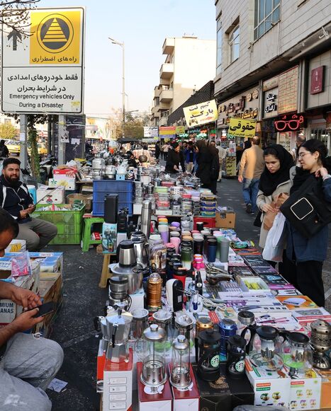 Women shop from a street vendor at Enghelab Square in the capital Tehran on Nov. 11, 2025. 