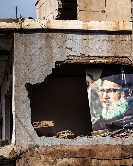 A portrait of the late Hezbollah leader Hassan Nasrallah is visible in heavily damaged building in the border town of Ayta al-Chaab, southern Lebanon, Feb. 21, 2026. 