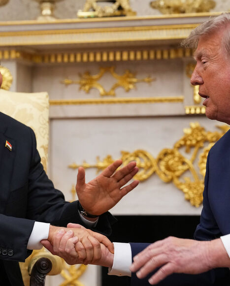 US President Donald Trump (R) shakes hands with Prime Minister of Iraq Ali al-Zaidi during a bilateral meeting in the Oval Office of the White House, Washington, July 14, 2026.