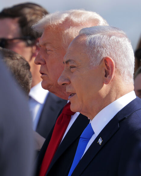 US President Donald Trump (C) is welcomed by Israeli Prime Minister Benjamin Netanyahu at Ben Gurion International Airport on Oct. 13, 2025 in Tel Aviv, Israel. 