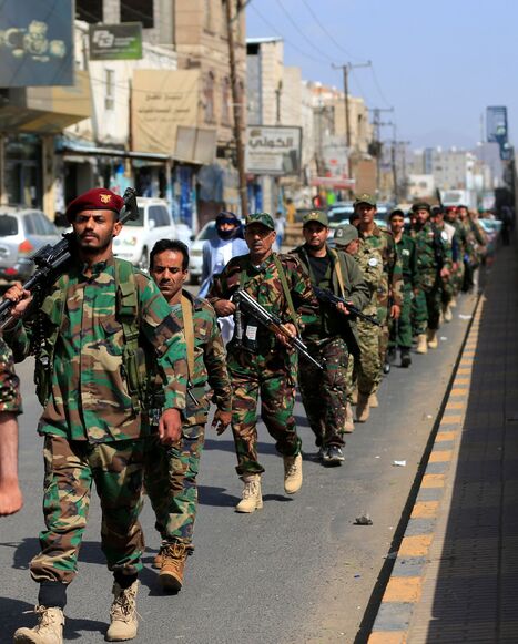 Houthi fighters marching