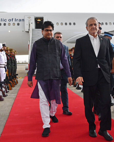 Iran's President Masoud Pezeshkian disembarks from his plane