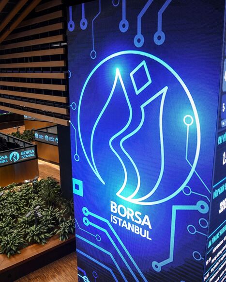 Traders work at their desks on the floor of the Borsa Istanbul