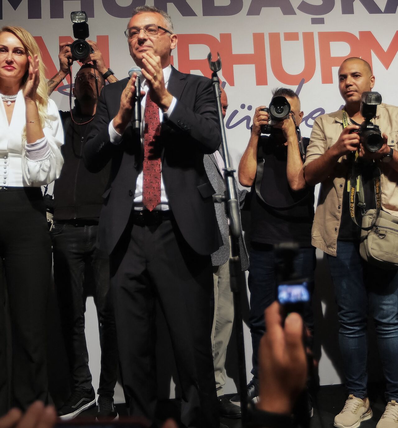 Tufan Erhurman and his wife, Nilden Erhurman, celebrate on stage after their victory in the Turkish Cypriot leadership election in the self-proclaimed Turkish Republic of Northern Cyprus on Oct. 19, 2025.