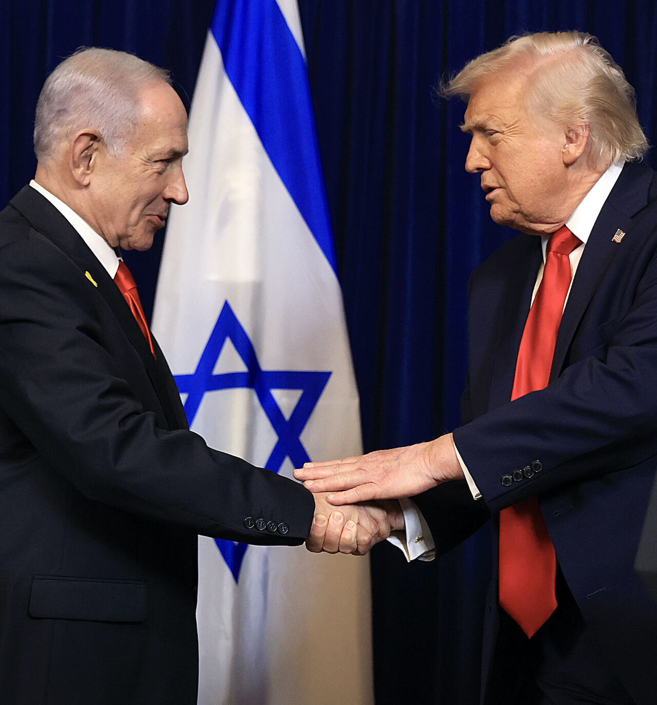 US President Donald Trump shakes hands with Israeli Prime Minister Benjamin Netanyahu during a press conference at his Mar-a-Lago club on Dec. 29, 2025 in Palm Beach, Florida. 