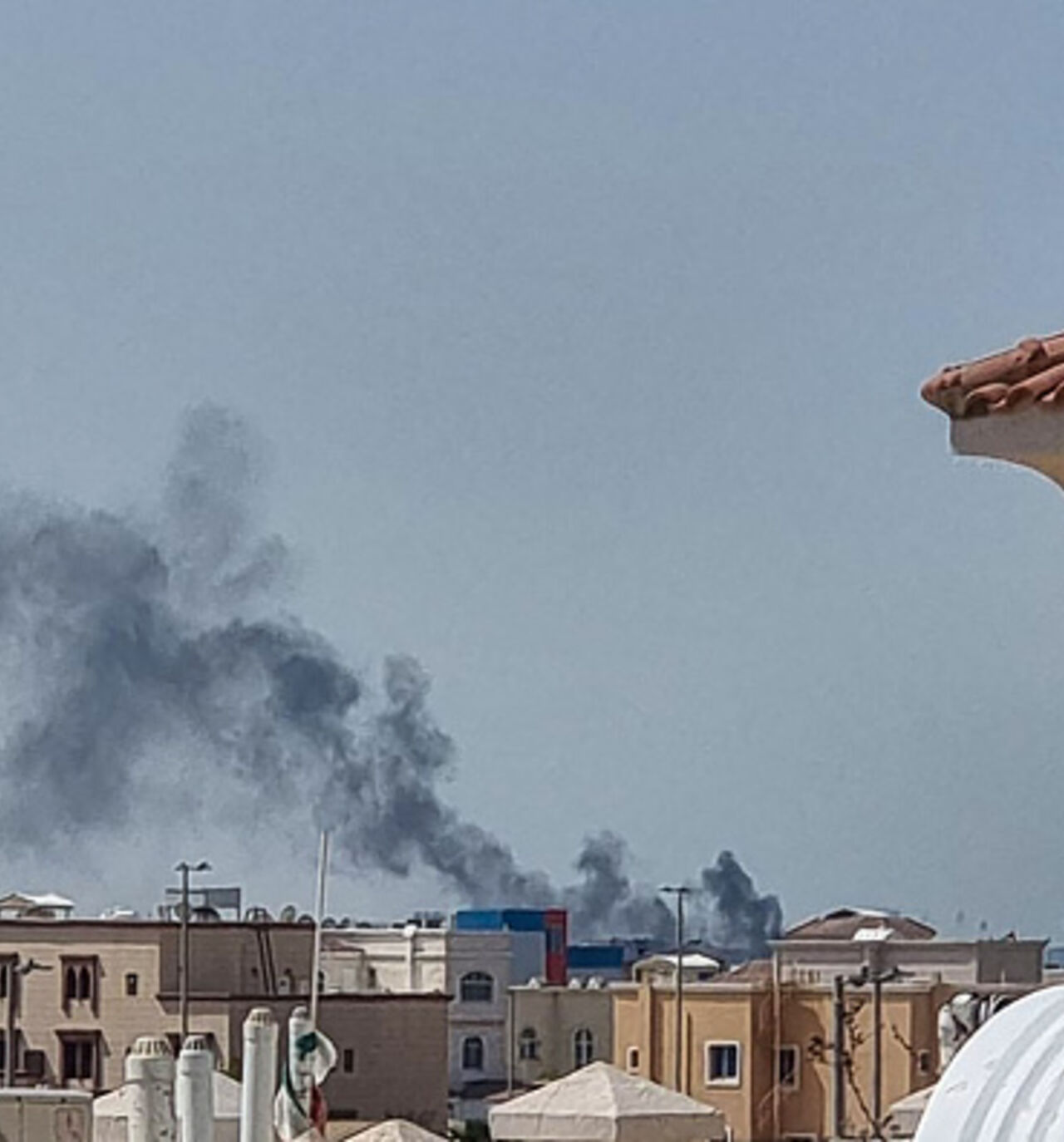 A smoke plume rises over Abu Dhabi from the site of an Iranian missile strike on February 28, 2026. Iranian missiles hit capital cities around the wealthy Gulf on February 28, killing at least one, in retaliation for a US and Israeli attack that threatened to spark a wider conflict. One civilian died in Abu Dhabi, capital of the United Arab Emirates, after being struck by falling debris, according to the ministry of defence. (Photo by AFP via Getty Images)