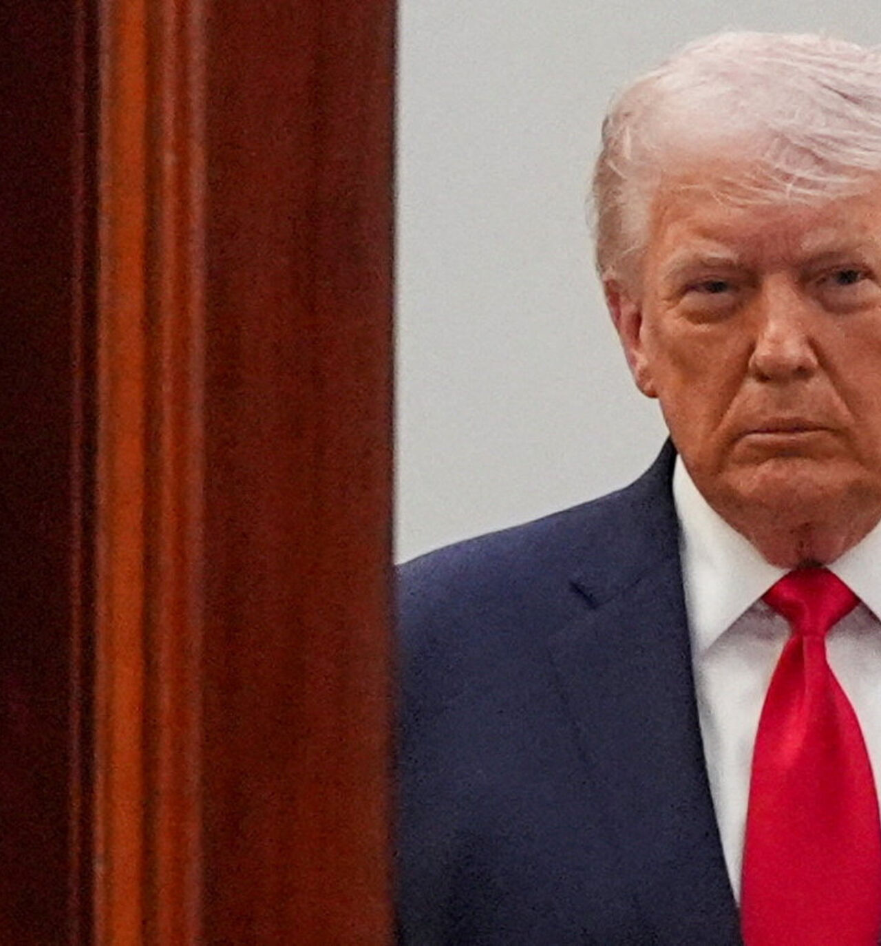 FILE PHOTO: President Donald Trump arrives from the Blue Room to speak about the Iran war from the Cross Hall of the White House on Wednesday, April 1, 2026, in Washington.     Alex Brandon/Pool via REUTERS/File Photo