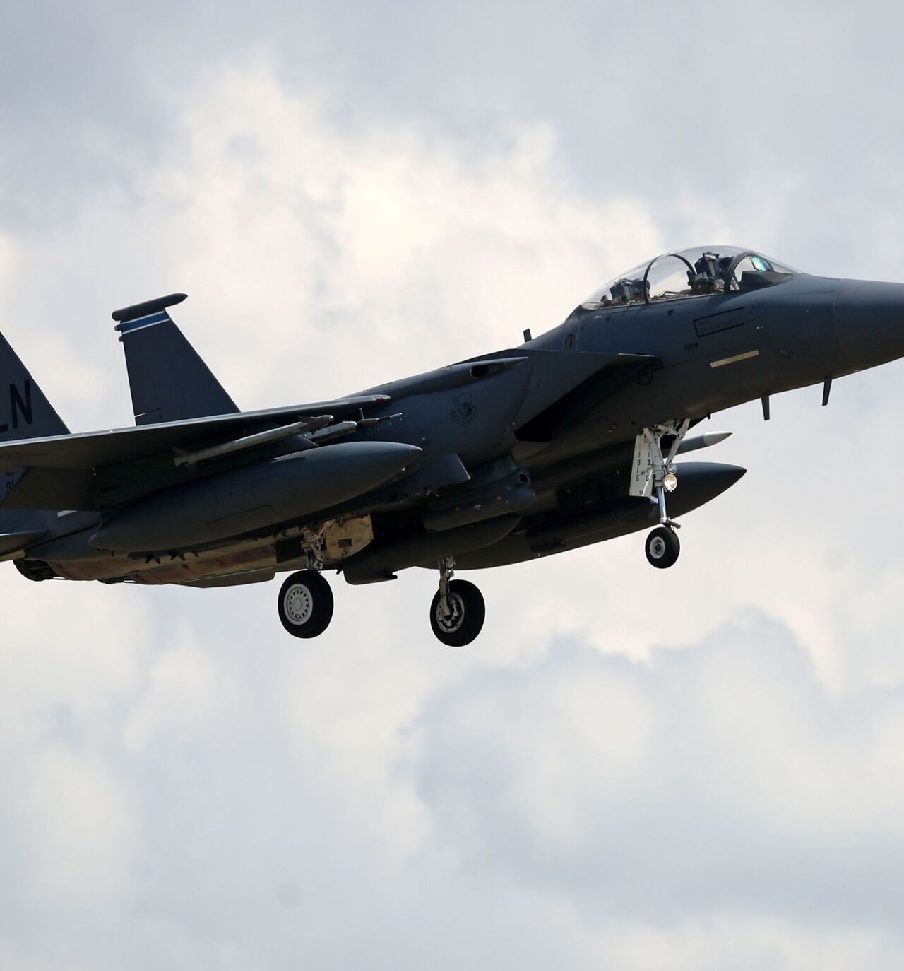 A US Air Force (USAF) F-15E Eagle fighter jet, is pictured as it prepares to land at RAF (Royal Air Force) Lakenheath, east of England, on June 15, 2020. - The UK Coastguard launched a search and rescue operation Monday to find the pilot of a US fighter jet that crashed during a training mission in the North Sea. The US Air Force said the F-15C Eagle went down after taking off from the RAF Lakenheath base near the town of Mildenhall in eastern England. The base is home to the 48th Fighter Wing, which has op