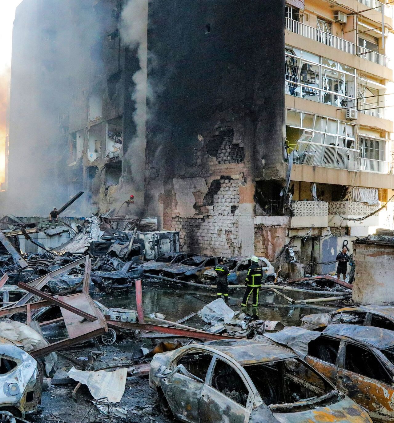 Firefighters attempt to extinguish a fire following an Israeli strike at the Corniche al-Mazraa neighbourhood of Beirut on April 8, 2026. 