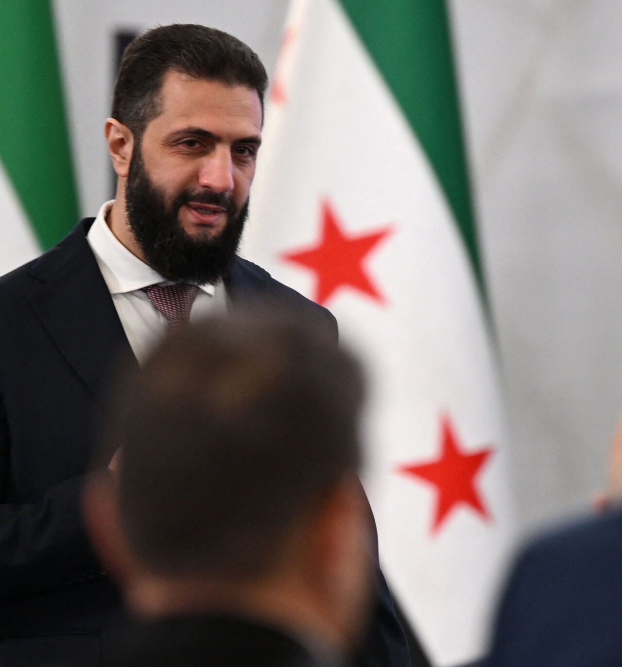 Syrian President Ahmed al-Sharaa arrives to attend the second day of the first Syrian-Emirati (United Arab Emirates) Investment Forum, at the People's Palace in Damascus on May 12, 2026. (Photo by LOUAI BESHARA / AFP via Getty Images)