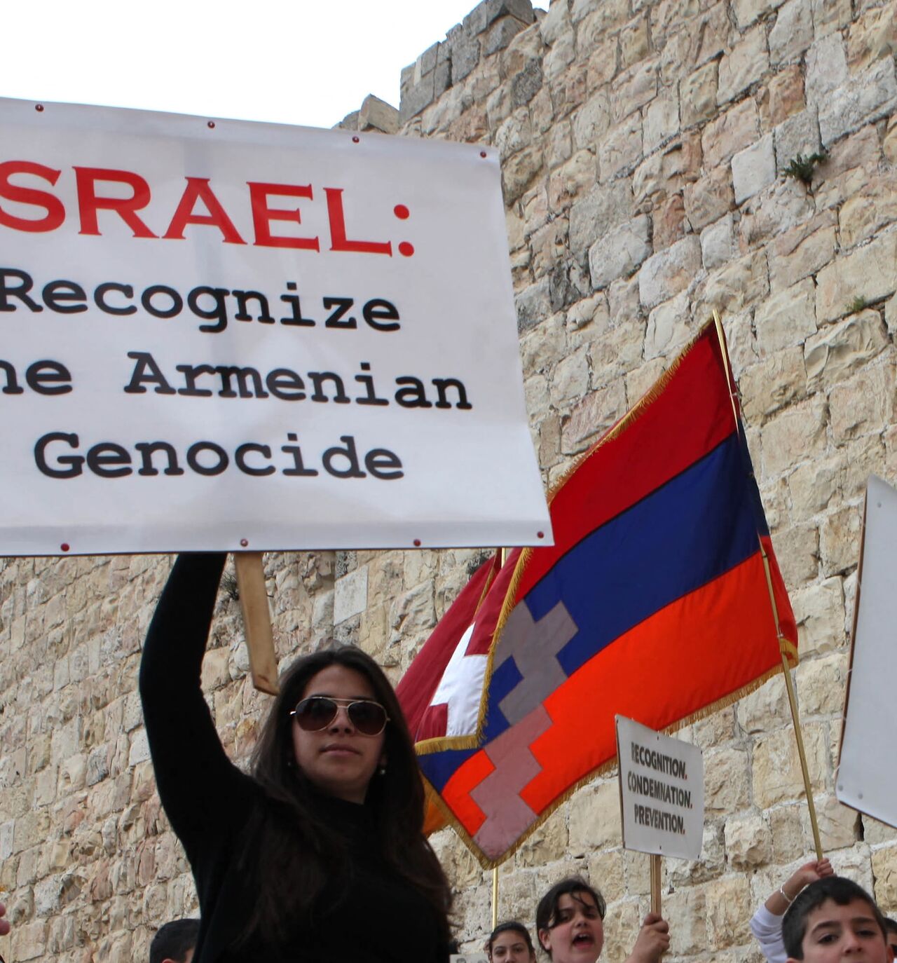 Members of the Jerusalem Armenian community hold placards as they march during commemorations for the 94th anniversary of mass killings of their kin under the Ottoman Empire, Jerusalem's Old City, April 24, 2009.