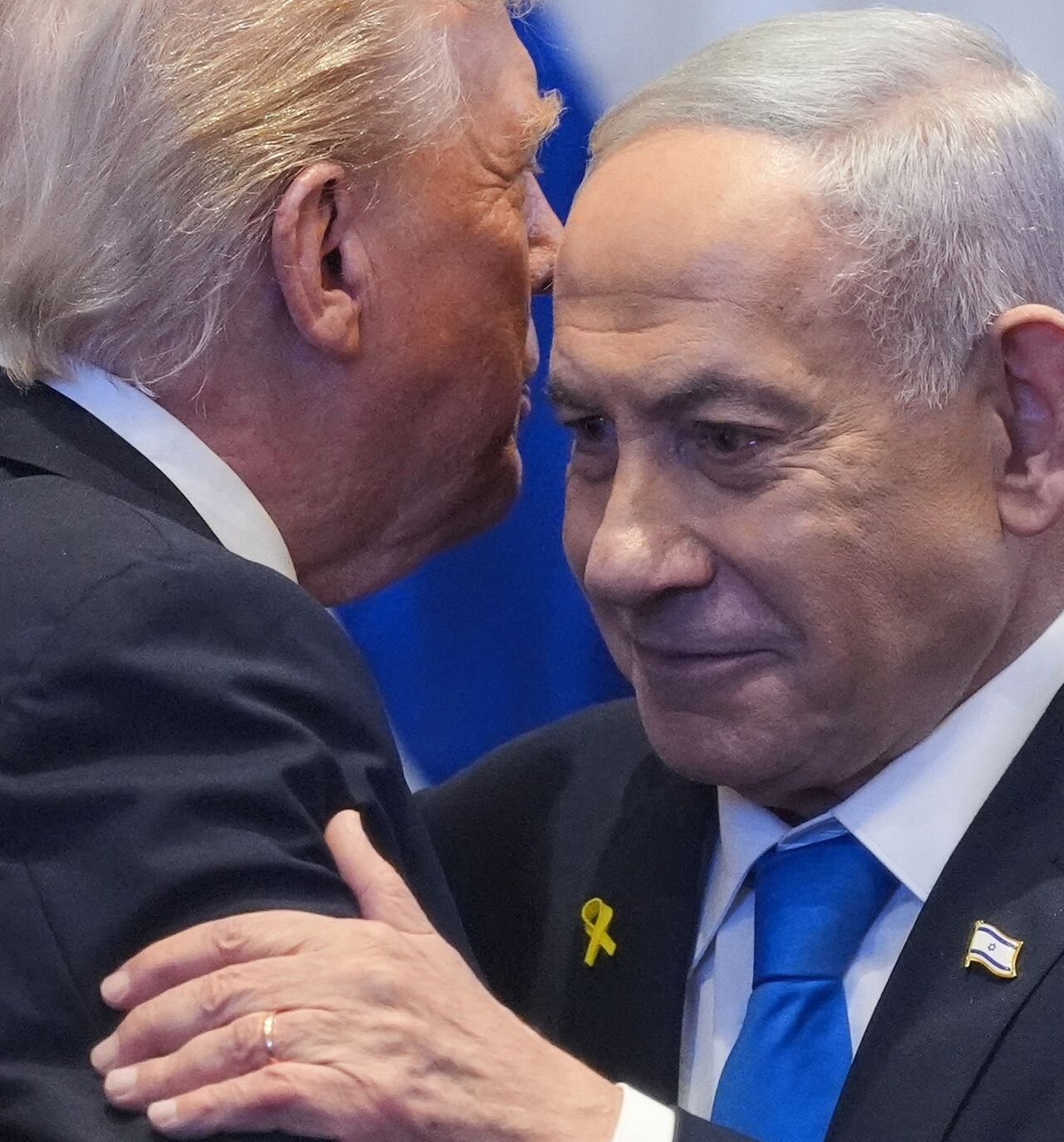 US President Donald Trump talks with Israeli Prime Minister Benjamin Netanyahu in the Knesset, Jerusalem, Oct. 13, 2025.