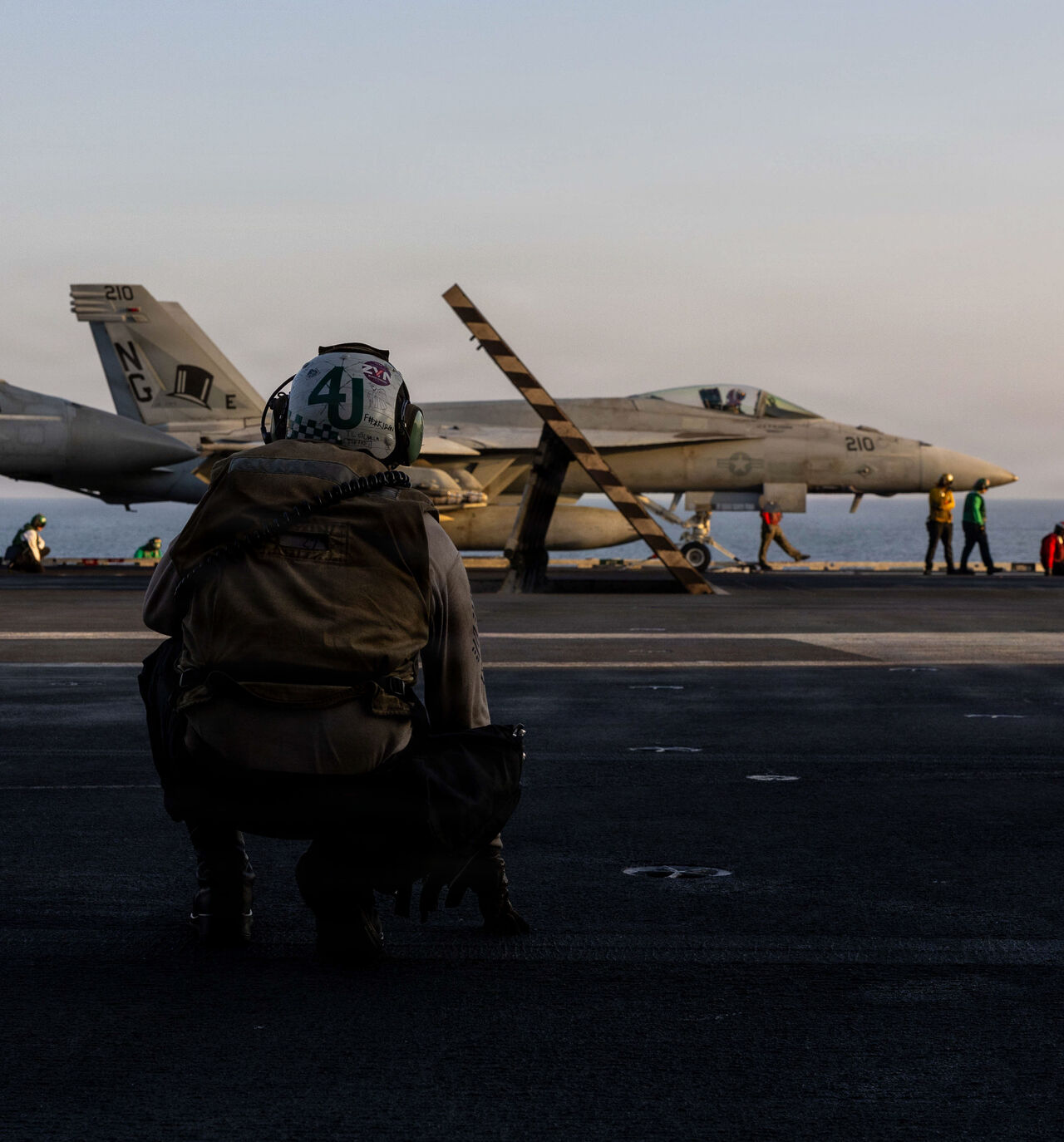 In this US Navy released handout, an F/A-18E Super Hornet, attached to Strike Fighter Squadron (VFA) 14, prepares to take off from the flight deck of Nimitz-class aircraft carrier USS Abraham Lincoln (CVN 72) in support of Operation Epic Fury on March 1, 2026 at Sea. 