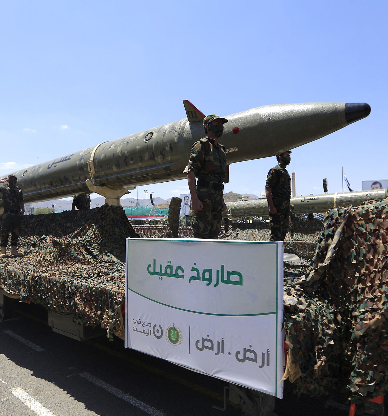Houthi soldiers stand guard on a missile carrier during an official military parade marking the ninth anniversary of the Houthi takeover of the capital, Sanaa, on Sept. 21, 2023.