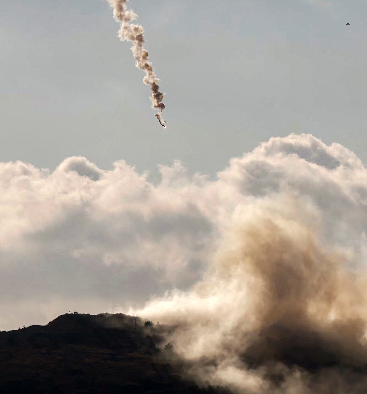 A flare fired by the Israeli military lands over the highlands of the area of Ali al-Taher as seen from nearby Marjayoun (Marjeyoun) in southern Lebanon on June 14, 2026.