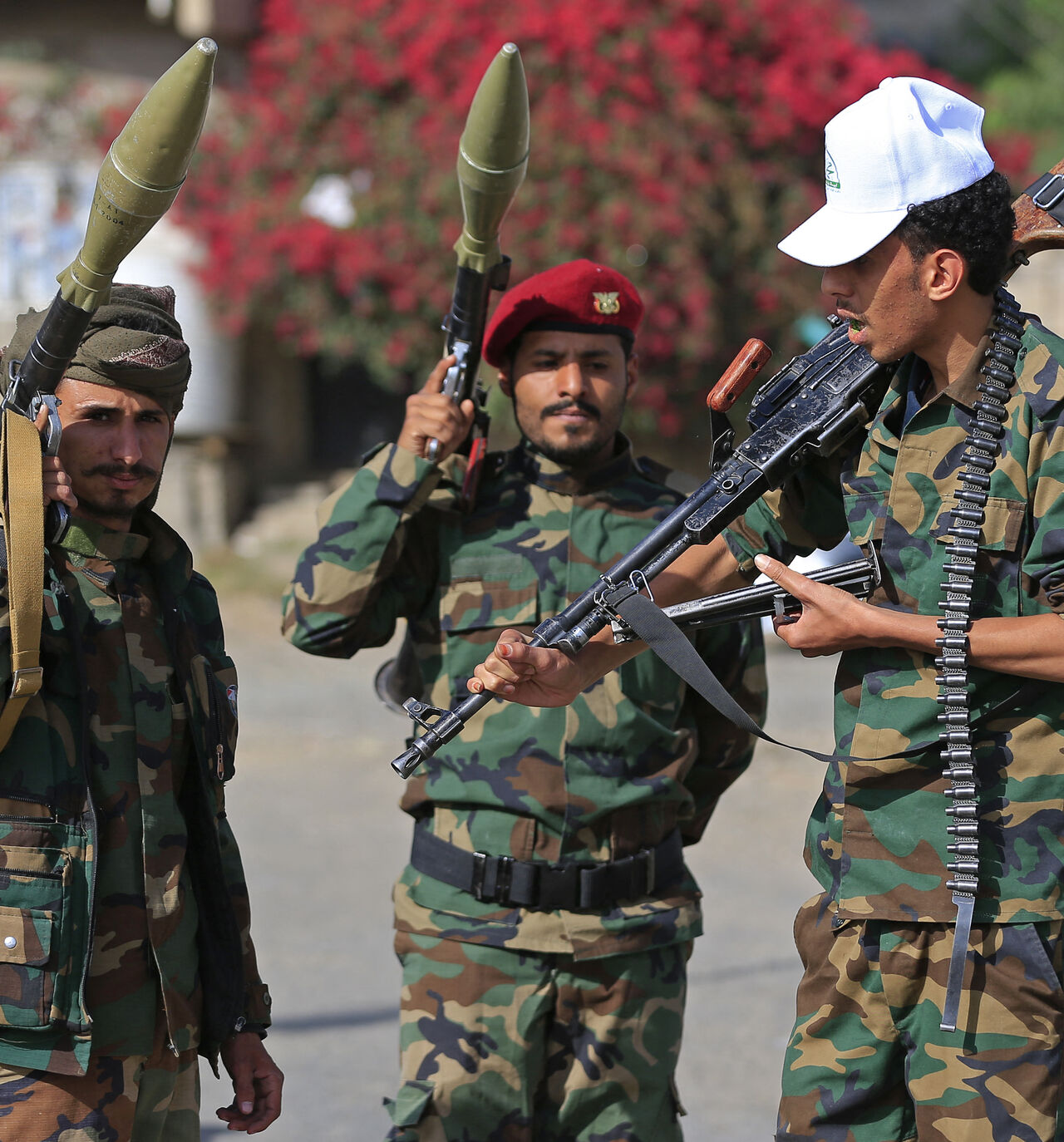 Fighters loyal to the Houthi authorities, brandish their weapons during a rally to recruit more fighters, in Sanaa on September 10, 2026. The country relapsed into war in July after years of calm, drawn into the regional conflict triggered by the US-Israeli offensive against Iran that began at the end of February. (Photo by Mohammed HUWAIS / AFP via Getty Images)