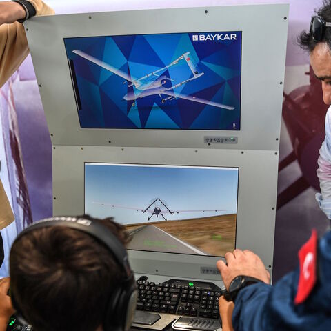 A Turkish boy uses a Turkish unmanned aircraft (ANKA) simulation unit on Sept. 20, 2018 at the Istanbul's new international airport, during the Teknofest aviation, space and technology fair. 