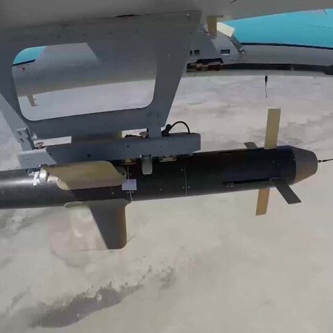 A handout picture provided by the Iranian army's official website on Sept. 11, 2020, shows an Iranian Simorgh drone carrying a weapon. 