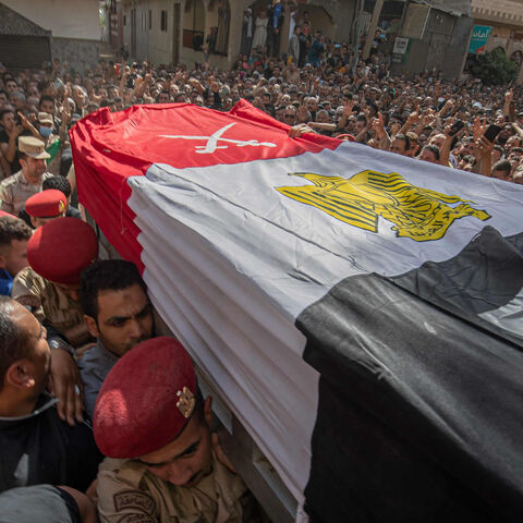 Mourners and soldiers carry the casket of Egyptian 1st Lt. Soleman Ali Soleman, one of 11 soldiers killed in an attack claimed by Wilayat Sinai, during his funeral at a mosque in the village of Jazirat al-Ahrar in Qalyoubiya province, Egypt, May 9, 2022.