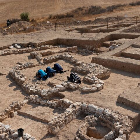 Muslim Palestinian workers of Israel's Antiquities Authority pray amid the remains of a recently discovered ancient mosque.