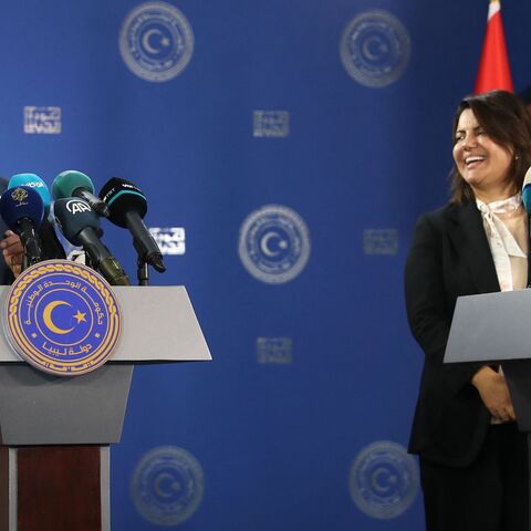 Libyan Foreign Minister Najla al-Mangoush (R) and Turkish Foreign Minister Mevlut Cavusoglu.