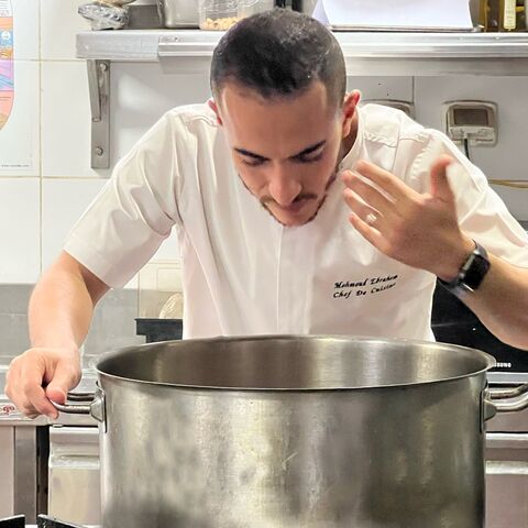 Chef Mahmoud Abd El Gaid prepares a veal steak at Pipa, an Italian restaurant, in Cairo on Monday Nov. 14, 2022.