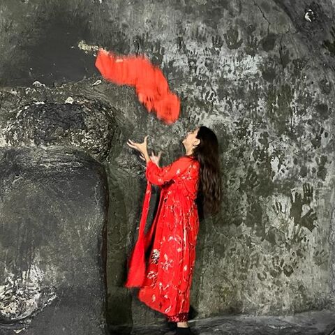 A Yazidi girl catches a scarf in a religious ritual at the Lalish temple in Dahuk, Nov. 17, 2022.