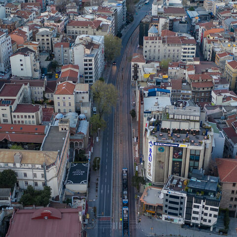 In this aerial photo from a drone, a tram passes an empty road in the Karakoy district on the final day of a four-day lockdown across Istanbul, Turkey, April 26, 2020.