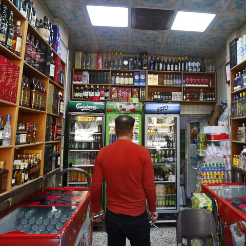 A man walks inside a liquor shop in Baghdad on February 23, 2023.  (Photo by MURTAJA LATEEF/AFP via Getty Images)