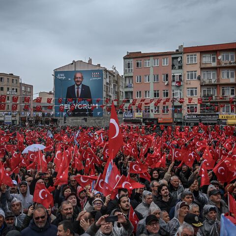 Supporters wave Turkish national flags as they attend a rally of Turkey's Republican People's Party (CHP) Chairman and Presidential candidate Kemal Kilicdaroglu in Canakkale, western Turkey, on April 11, 2023. - A sea of umbrellas and hoods at his feet, Kemal Kilicdaroglu, the Turkish opposition candidate who will challenge Recep Tayyip Erdogan at the polls on 14 May, smilingly promises "the return of spring". (Photo by OZAN KOSE / AFP) (Photo by OZAN KOSE/AFP via Getty Images)