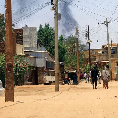 Smoke rises behind buildings in Khartoum on April 19, 2023, as fighting between the army and paramilitaries raged for a fifth day after a 24-hour truce collapsed.