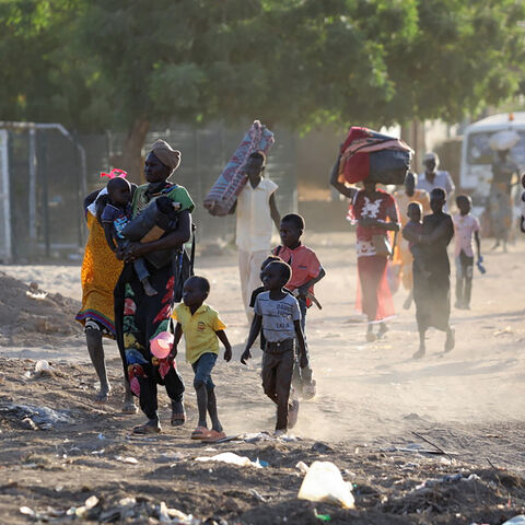 People flee their neighborhoods amid fighting between the army and paramilitaries, following the collapse of a 24-hour truce, Khartoum, Sudan, April 19, 2023.