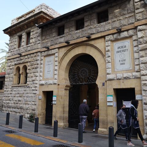 People walk past the main gate to the campus of the American University of Beirut (AUB) in the heart of the Lebanese capital, on January 13, 2022. - Power shortages and soaring petrol prices mean many Lebanese students can neither afford to reach their classes nor study from home, a conundrum that is ravaging a generation's future. (Photo by ANWAR AMRO / AFP) (Photo by ANWAR AMRO/AFP via Getty Images)