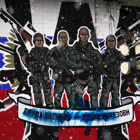 This picture shows a defaced mural to the glory of Russia's mercenary group Wagner reading "Wagner Group."