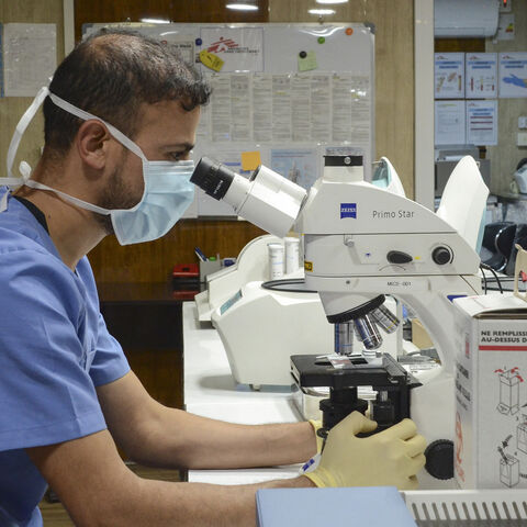 A medic works at a laboratory at the Nablus hospital, run by Doctors Without Borders (MSF), in Iraq's northern city of Mosul on Dec. 16, 2021. 