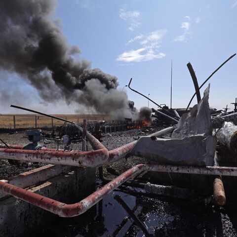  Smoke billows from the Babasi oil facility in the countryside of al-Qahtaniya in Syria's Kurdish-controlled northeastern Hasakeh province on October 6, 2023 following a Turkish strike. (Photo by Delil souleiman / AFP) / "The erroneous mention[s] appearing in the metadata of this photo by Delil souleiman has been modified in AFP systems in the following manner: [BABASI] instead of [BASBASI]. Please immediately remove the erroneous mention[s] from all your online services and delete it (them) from your serve