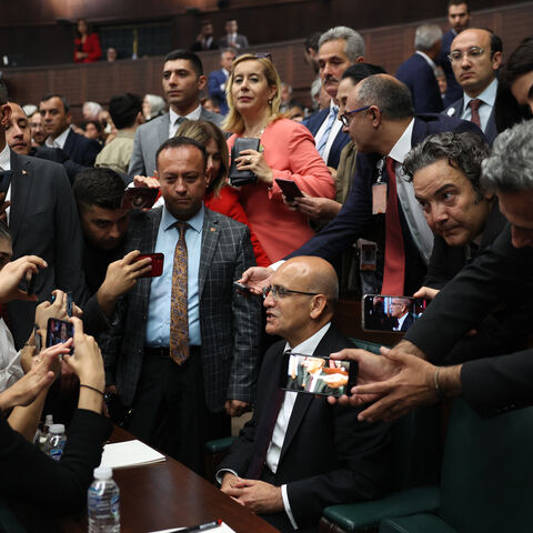 Turkish Treasury and Finance Minister Mehmet Simsek (C) addresses a statement to the journalists at the party's group meeting at the Turkish Grand National Assembly (TBMM) on June 21, 2023. (Photo by Adem ALTAN / AFP) (Photo by ADEM ALTAN/AFP via Getty Images)