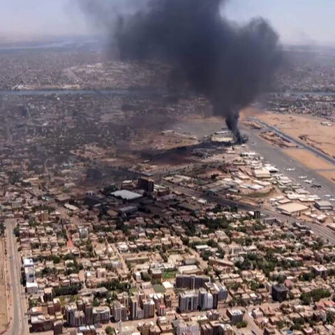 This image grab taken from AFPTV video footage on April 20, 2023, shows an aerial view of black smoke rising above the Khartoum International Airport amid ongoing battles between the forces of two rival generals. 