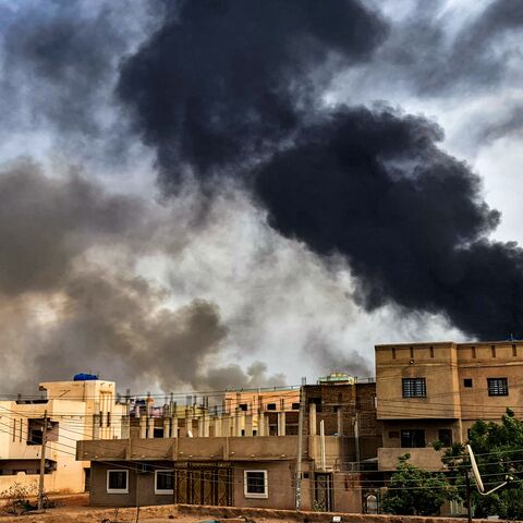 Smoke plumes billow from a fire at a lumber warehouse in southern Khartoum amidst ongoing fighting on June 7, 2023. Eight weeks of fighting have pitted Sudan's army chief Abdel Fattah al-Burhan against his former deputy Mohamed Hamdan Daglo -- commonly known as Hemeti -- who commands the powerful paramilitary Rapid Support Forces (RSF). A number of broken ceasefires have offered brief lulls but no respite for residents of Khartoum, where witnesses again reported "the sound of heavy artillery fire" in the ca